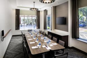 a conference room with a long table and chairs at Hyatt Place Sumter/Downtown in Sumter +34 photos