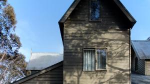 a house with a window on the side of it at Burramys in Dinner Plain +5 photos