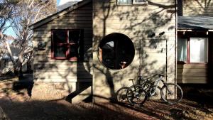 a bike parked on the side of a house at Burramys in Dinner Plain