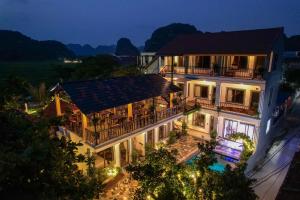 an aerial view of a building at night at Rice Fields Mountain Homestay in Vũ Lâm