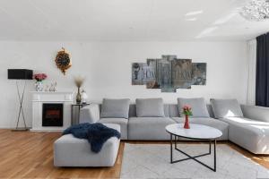 a living room with a couch and a table at Villa in Skurup in Skurup