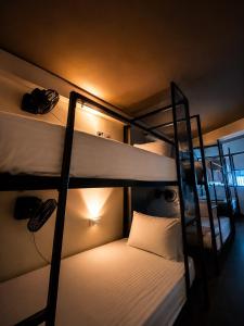 a room with two bunk beds with a light on at Igloo Stays Edapally in Cochin