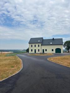 a house on the side of a road at Flachsberg in Huf