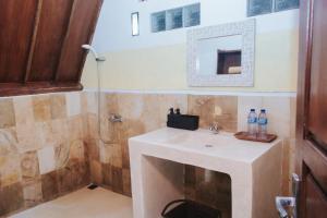 a bathroom with a sink and a shower at Lucy's Garden Hotel in Gili Islands +81 photos