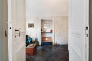 a room with a door and a table in it at P43 Sicilian Suites in Ragusa