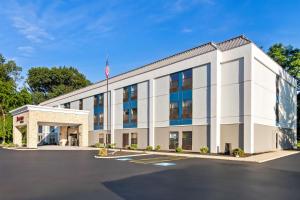 an office building with an american flag on top at Hampton Inn Portage in Portage
