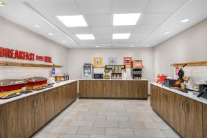 a restaurant with wooden counters in a room at Hampton Inn Portage in Portage