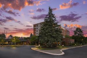 a large christmas tree in front of a building at Doubletree by Hilton, Leominster in Leominster