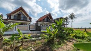 an image of a house with a garden at Private Villa close to Ubud in Darmasaba