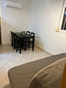 a dining room with a table with chairs at Platamon house in Platamonas