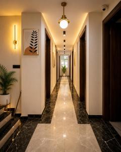 a hallway of a building with a tile floor at SG Royal Portico in Haridwār