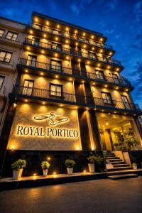 a hotel with a sign on the front of it at SG Royal Portico in Haridwār +3 photos