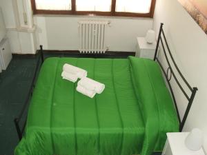 A bed or beds in a room at B&B La Cubanina