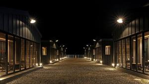 a long hallway with lights in a building at night at Yangyang Sloskip in Yangyang