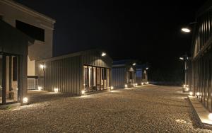 a row of buildings lit up at night at Yangyang Sloskip in Yangyang +7 photos