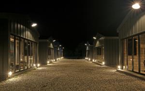 an empty street at night with lights on it at Yangyang Sloskip in Yangyang