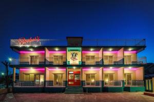 a building with purple lights on the side of it at Yangyang Bookers Beach Motel in Yangyang