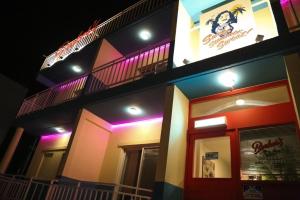 a building with purple lights on the side of it at Yangyang Bookers Beach Motel in Yangyang
