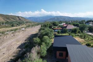 an aerial view of a village with mountains in the background at Mountain View in Türgen