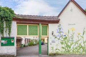 a building with a green pole in front of it at Untermühle Horchheim in Worms