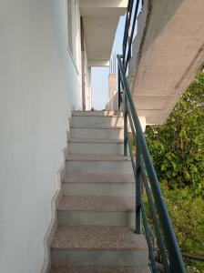 a stairway leading up to a building at Hotel rose palace in Dehradun +6 photos