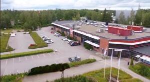 an aerial view of a parking lot in front of a building at Fox Center Matkaparkki Järvenpää Only Parking Slot in Järvenpää