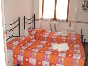 A bed or beds in a room at B&B La Cubanina