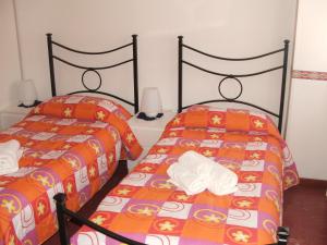 A bed or beds in a room at B&B La Cubanina