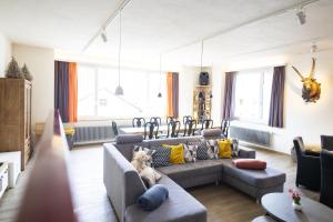 a living room with two couches and a couch at Chasa Macun in Schleins