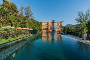 a swimming pool in front of a building at Marina Sands Resort in Ko Chang +39 photos