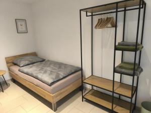 a bedroom with a bunk bed and a shelf at FeWo 180° MOSELWeitblick in Neumagen-Dhron