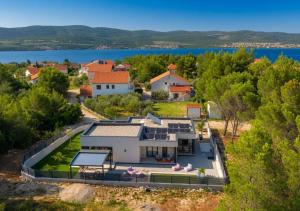 an aerial view of a house with a tennis court at Casa Palmera in Pridraga
