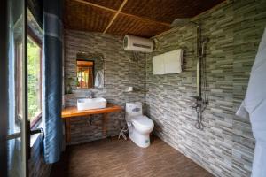 a bathroom with a white toilet and a sink at Vanhaus in Sapa +77 photos