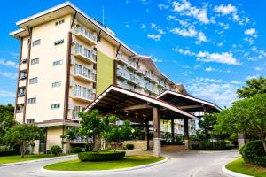a building with awning in front of a street at Cebu Airport Layover Stay in Pusok