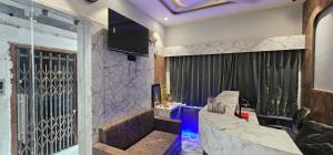 a living room with a staircase and a window at Hotel Prime Gold in Ahmedabad