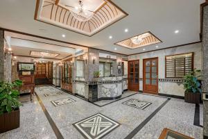 a lobby of a building with a chandelier at Hotel Karl Residency in Mumbai