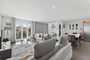 a living room with a couch and a table at Florentina Villa in Gaula