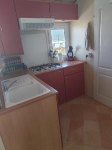 a kitchen with a sink and a stove at San gavino in Savines