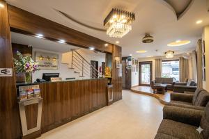 a lobby with a waiting room and a pharmacy at Hotel Anand - Near Ganga Ram & BLK Hospital At Karol Bagh Metro Station in New Delhi