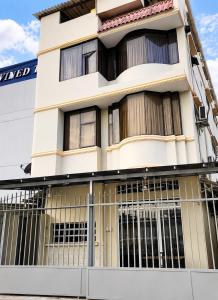 a building with bars in front of it at Hostal Posada Del Sol in Guayaquil +21 photos