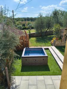 a swimming pool in the middle of a yard at Agriturismo Rosetta in Montevarchi