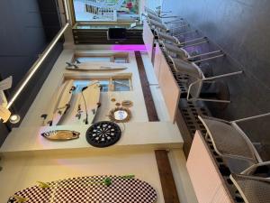 an overhead view of a staircase with a table and chairs at Yangyang Kai Guesthouse Surf in Yangyang