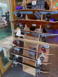 a bunch of skateboards on a rack in a store at Yangyang Kai Guesthouse Surf in Yangyang