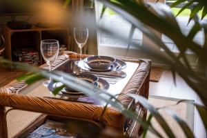 a table with plates and glasses on a table at Dreish - Glamping Pod in Forfar
