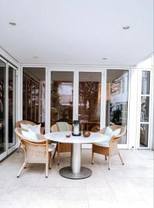 a white table and chairs on a patio at Casa CedenoXavi in Santa Ponsa