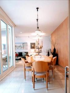 a dining room with a table and chairs at Casa CedenoXavi in Santa Ponsa +7 photos
