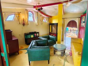 a living room with a couch and a table at Thien Y Villas in Hue