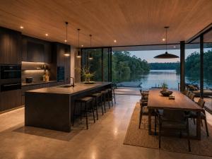 a kitchen with a large island and a view of a lake at De Holiday Home in Haenertsburg