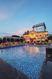 a large swimming pool in front of a building at Lavanya Hotel- Near Alipur, Delhi in New Delhi