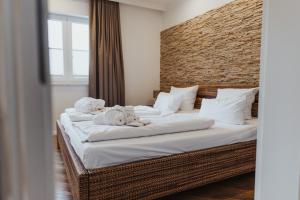 a bedroom with two beds with towels on them at Villa Vivaldi in Kühlungsborn